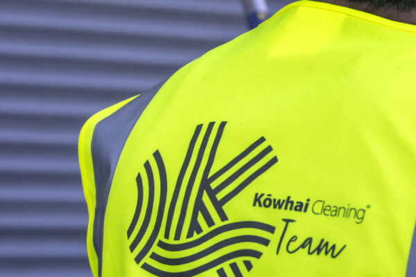 Power Wash Technician Servicing Exterior of Retail Outlet Supermarket