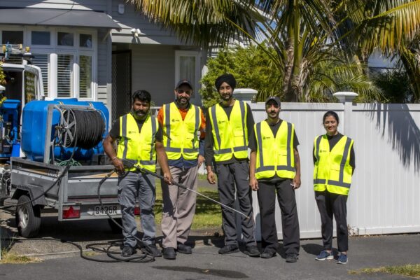 Kowhai Cleaning residential exterior wash team with trailer-mounted water blasting system on site
