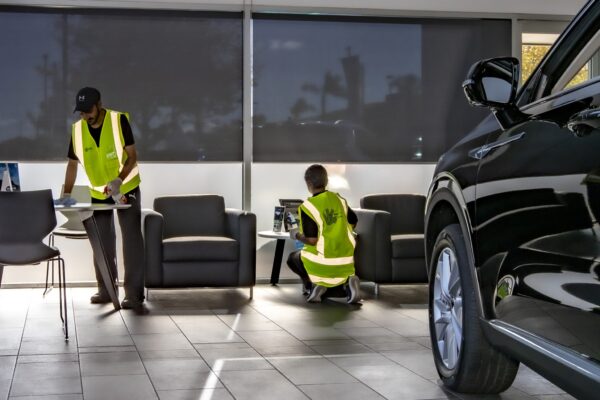 Kowhai Cleaning staff performing professional showroom cleaning for a car dealership in New Zealand, ensuring spotless interiors and customer-ready presentation.
