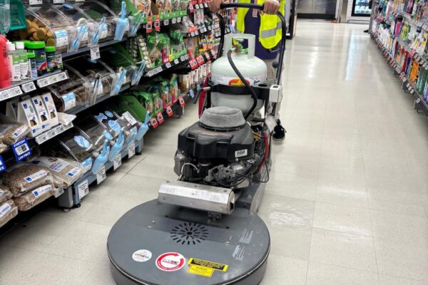 Professional floor buffing service in retail store by Kowhai Cleaning technician in Auckland
