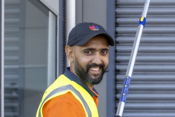 Kowhai Cleaning staff member performing outdoor window and exterior cleaning in Christchurch